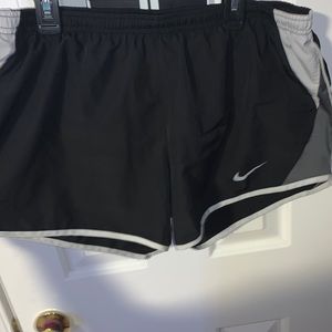 Black Nike shorts with white and gray sidings.